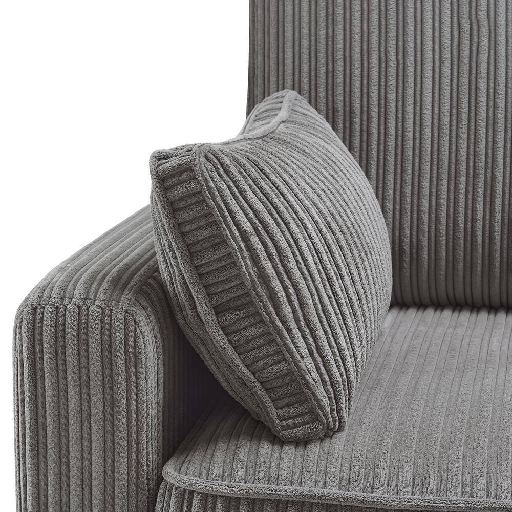Close-up of a gray corduroy throw pillow resting on a gray corduroy couch.