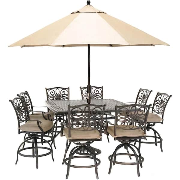 Hanover Traditions 9-Piece Aluminum Outdoor Dining Set with Natural Oat Cushions, 8-Swivel Chairs, Table, Umbrella and Stand