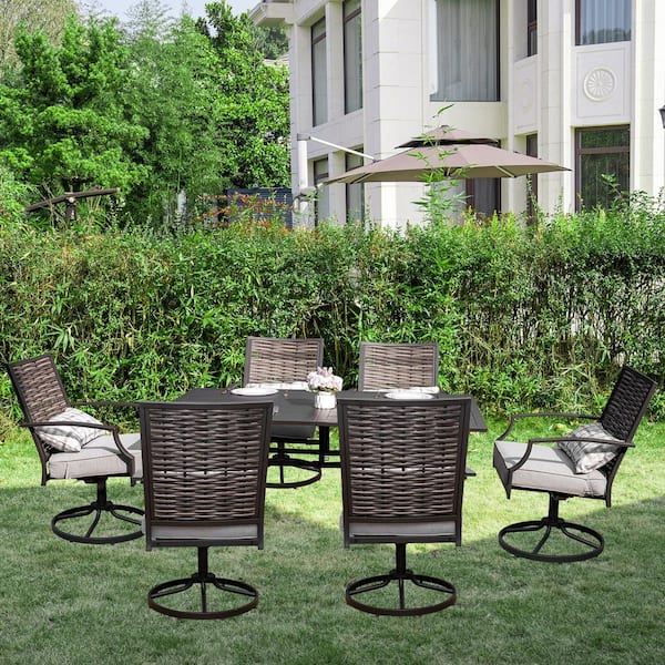 7-Piece Metal Outdoor Dining Set with Light Gray Cushions and Swivel Wicker Chairs