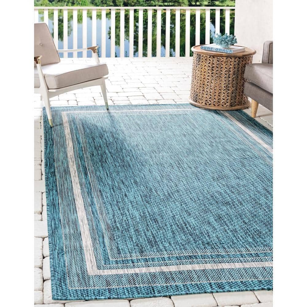 5' x 8' Teal Blue and Beige Flat Woven Outdoor Area Rug