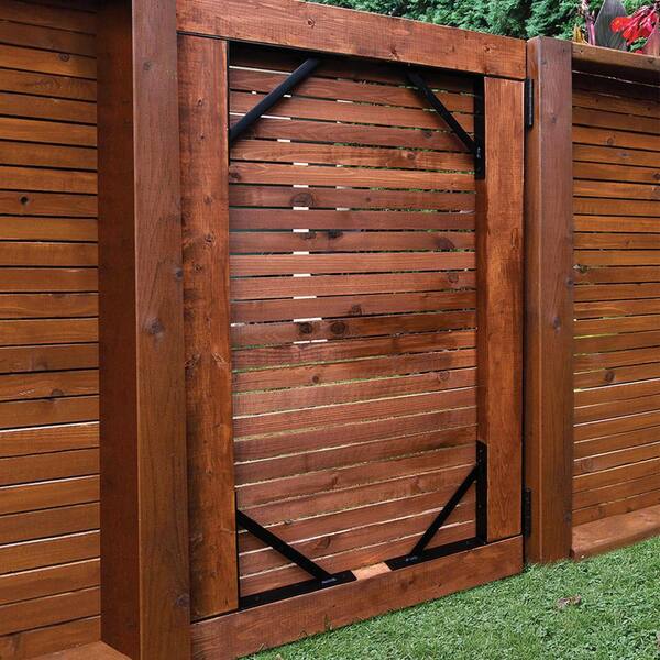 Modern Wooden Gates with stainless steel frame. Hard wood boards are  stained with Sadolin Ultra Walnut stain and f…