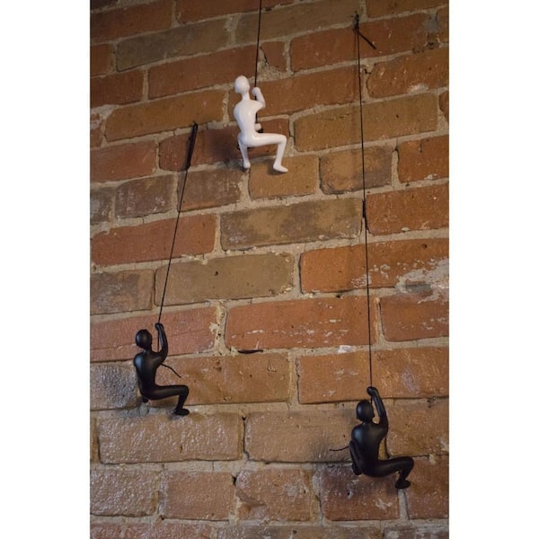 HomeRoots 6 in. White Unique Climbing Man Wall Art in White