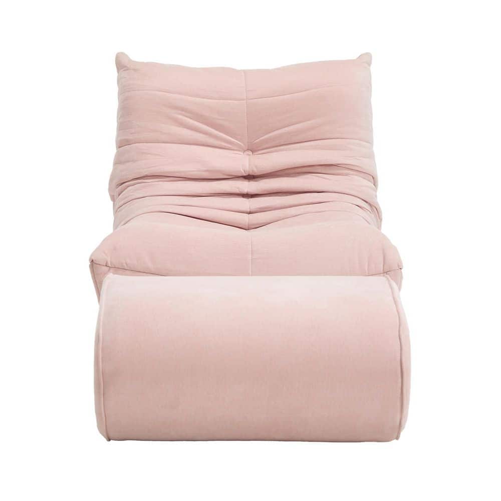 Front view of a pink tufted bean bag sofa with a matching ottoman.