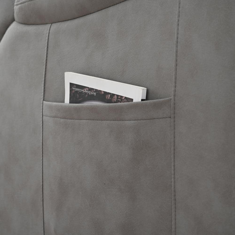 Close-up of the side storage pocket on a dark gray recliner.