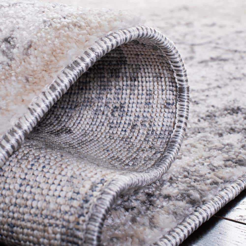 Ivory and Grey Abstract 8' x 10' Synthetic Area Rug