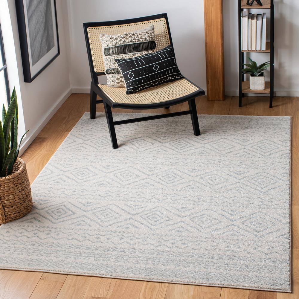 Ivory and Light Grey Geometric 6' x 9' Synthetic Area Rug