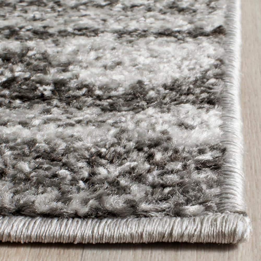 Ivory and Charcoal 6' x 9' Hand-knotted Synthetic Area Rug