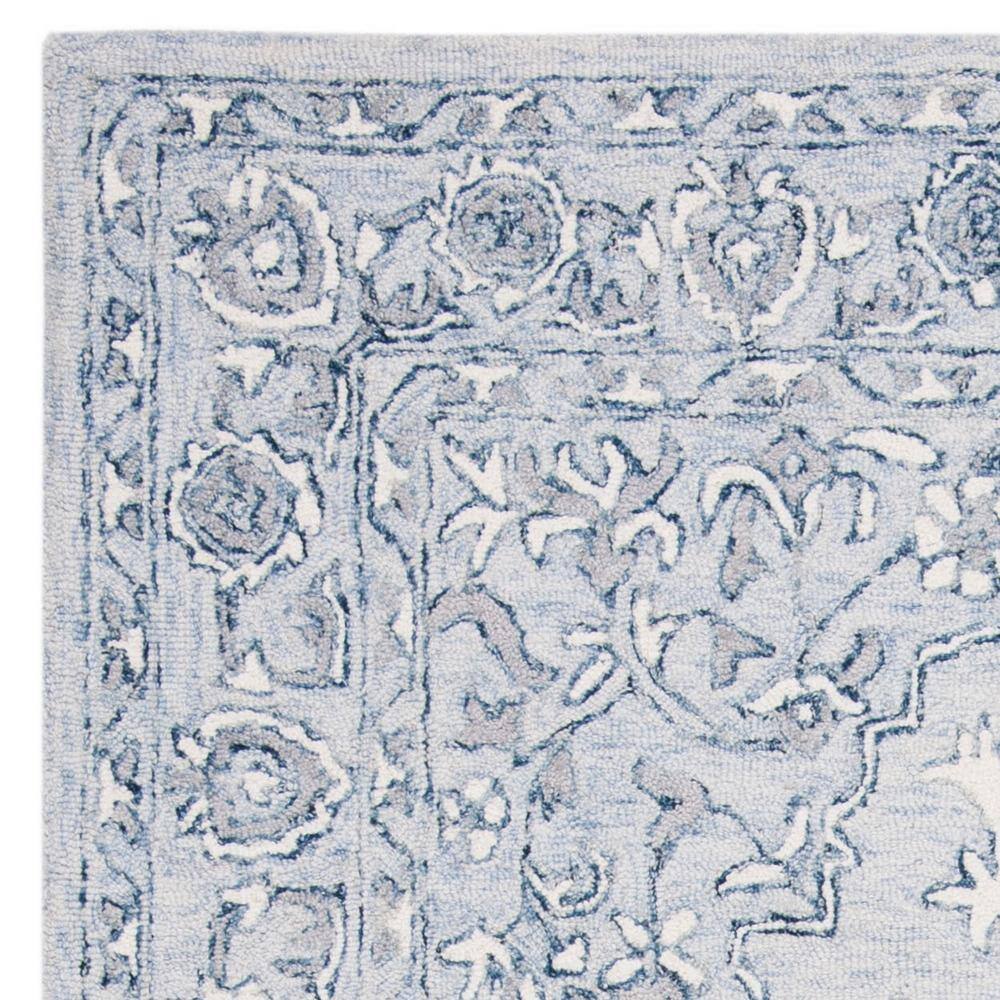 Handmade Light Blue/Ivory Tufted Wool 5' x 8' Area Rug