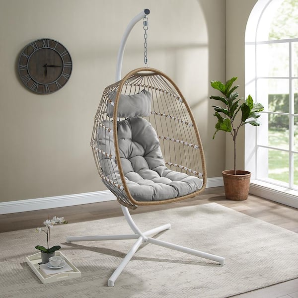 Walker Edison Furniture Company 1-Person Brown Rattan Patio Swing Egg Chair with White Stand and Gray Cushions