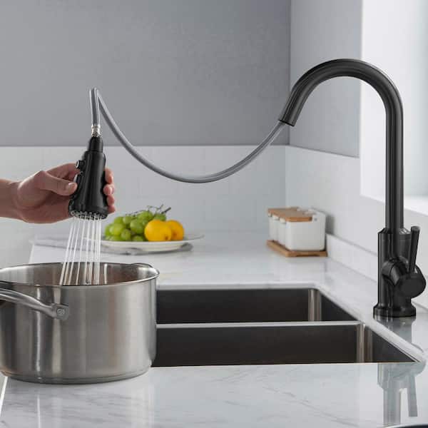 https://images.thdstatic.com/productImages/3791f9bf-a5cb-4dc0-a021-55c331e749fe/svn/matte-black-woodbridge-pull-down-kitchen-faucets-wk101201bl-40_600.jpg