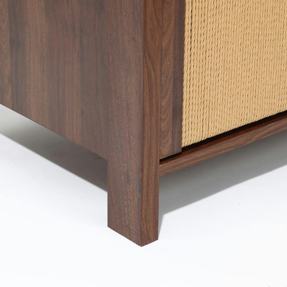 Close-up detail of the walnut wood frame and beige rope drawer front.