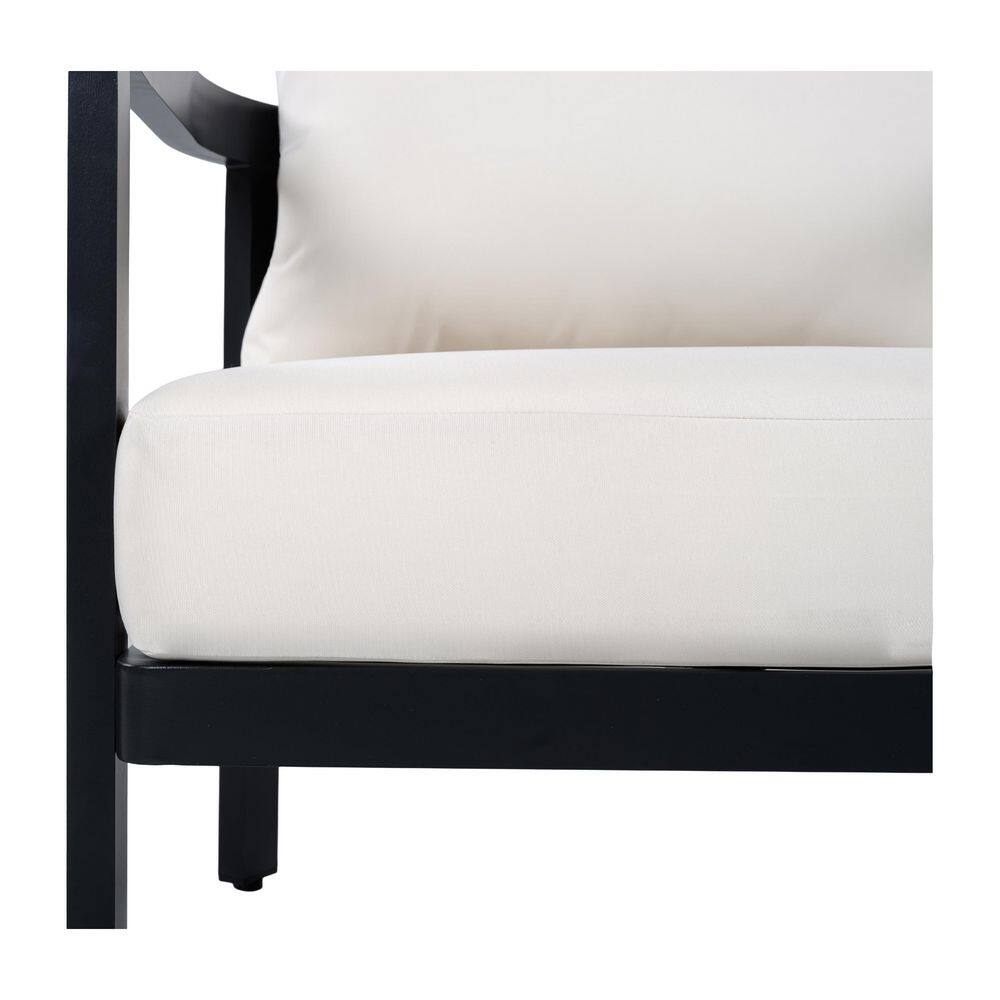 Close-up of the white cushion and black frame of an outdoor chair.