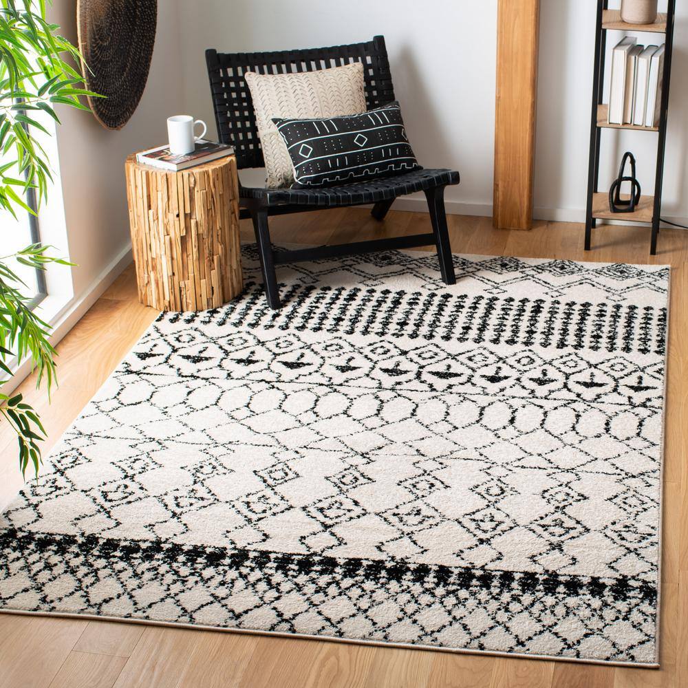 Ivory/Black Synthetic 6' x 9' Hand-Knotted Boho-Chic Area Rug