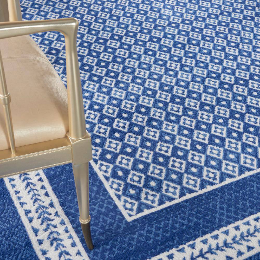 Ivory Geometric 7'10" x 10' Flat Woven Synthetic Area Rug
