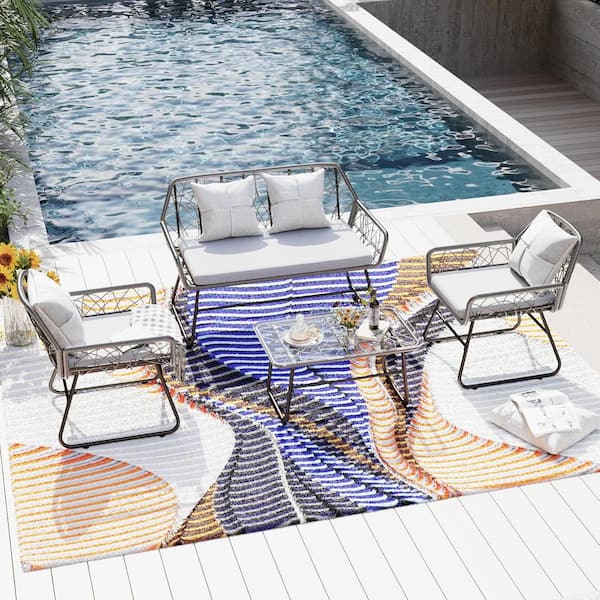 Zeus & Ruta 4-Piece Grey Wicker Patio Outdoor Sectional Sofa Set with Soft Grey Cushions and Glass Table for Patio Backyard Pool