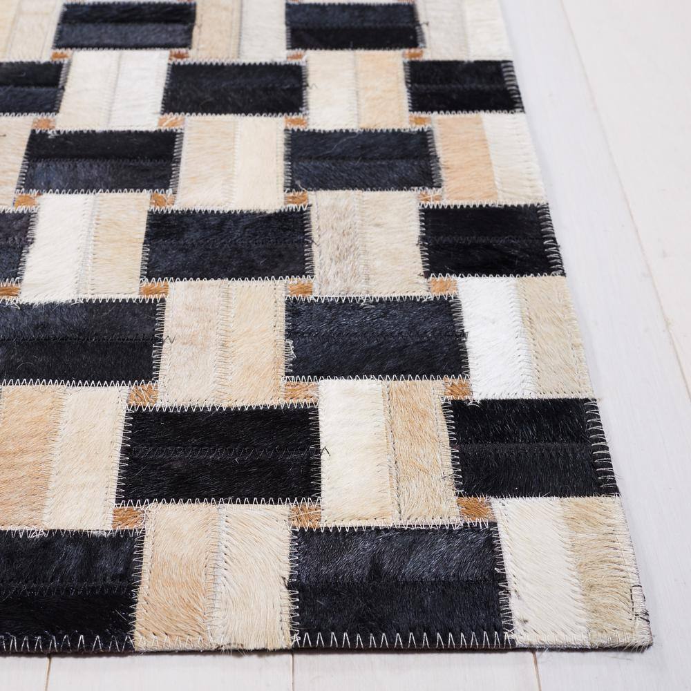 Black and Ivory Geometric Cowhide Area Rug