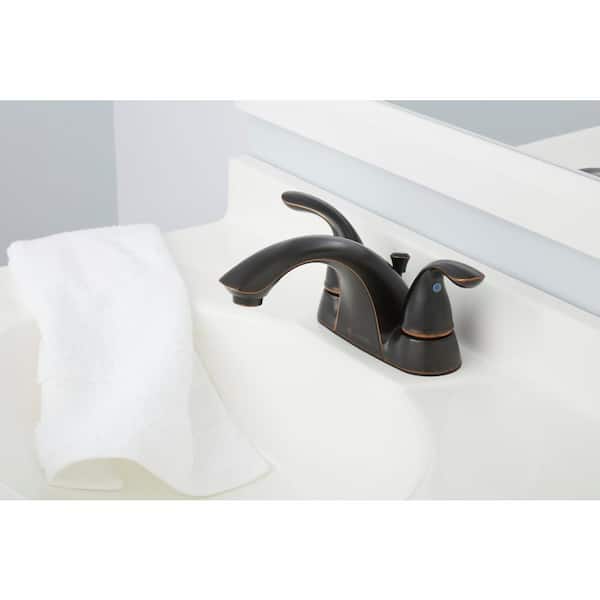 Builders 4 in. Centerset Double Handle Low-Arc Bathroom Faucet in Bronze