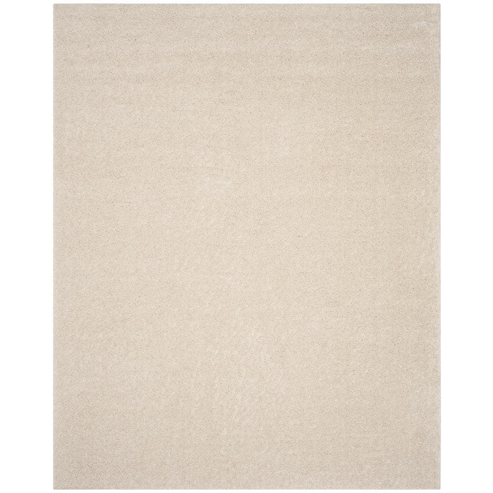 Cream 8' x 10' Tufted Shag Area Rug