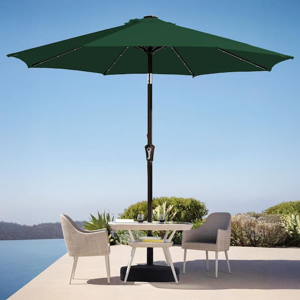 dark green 9 ft patio umbrella with led lights JEAREY 9 ft. Market Solar LED Lighted Tilt Patio Umbrella Outdoor Steel Umbrella in Dark Green