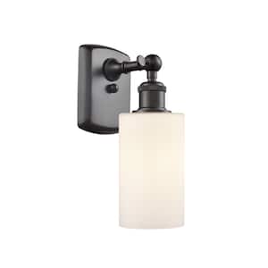 Clymer 1-Light Oil Rubbed Bronze Wall Sconce with Matte White Glass Shade