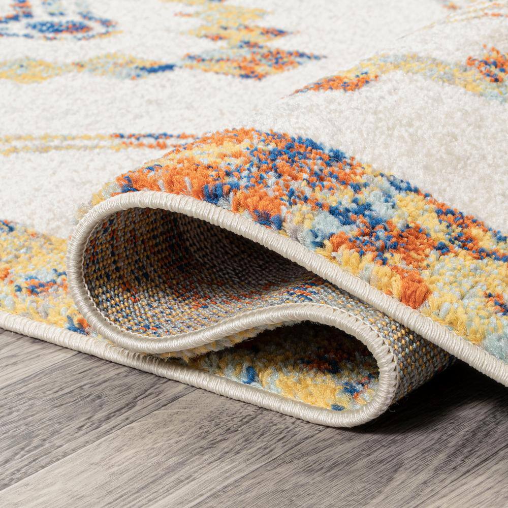 Ivory and Blue Geometric 8' x 10' Synthetic Area Rug