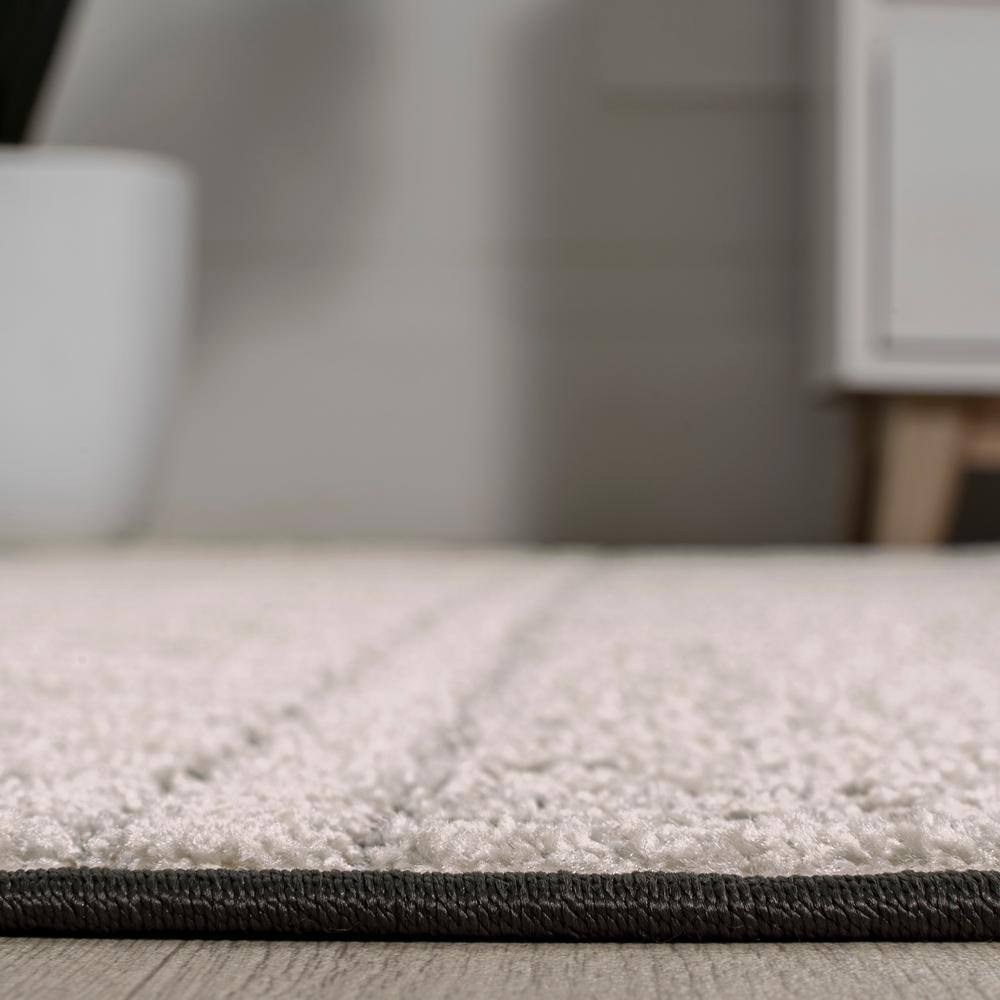 Cream and Black Geometric Synthetic Indoor/Outdoor Area Rug