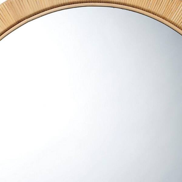 Round mirror in rattan frame
