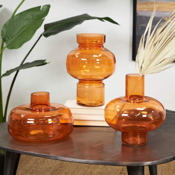 Litton Lane Mavern 12 in. Orange Round Glass Decorative Vase with Varying Shapes and Sizes (Set of 3)