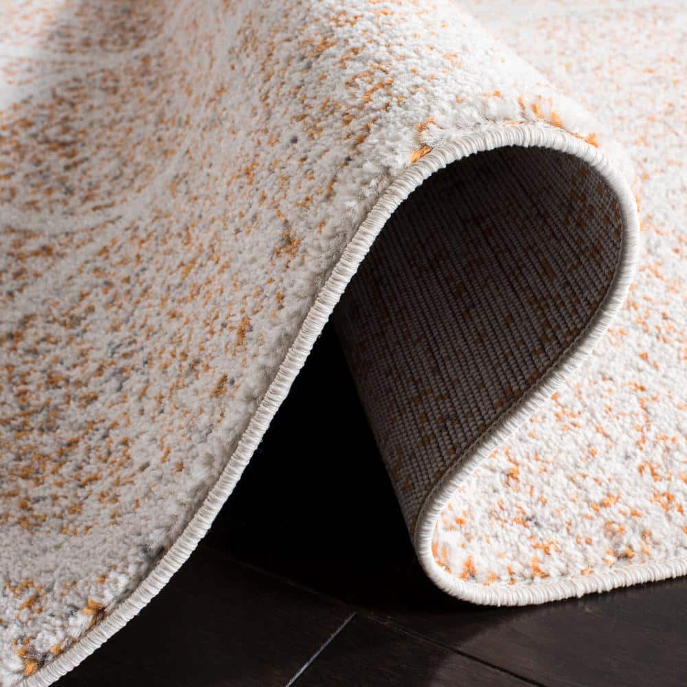 Cream/Orange Easy-Care Synthetic 9' x 12' Area Rug
