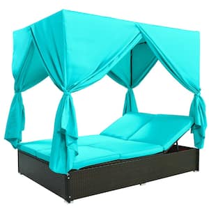 Black Wicker Rattan Outdoor Day Bed with Blue Cushions and Adjustable Seats and Blue Curtains