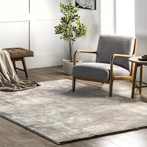 Loni Solid Machine Washable Shag Beige 6 ft. x 9 ft. Area Rug