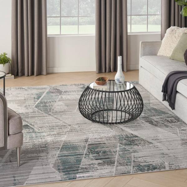 https://images.thdstatic.com/productImages/3a9fd691-8acb-511d-b963-501fef874246/svn/grey-beige-nourison-area-rugs-078117-e1_600.jpg