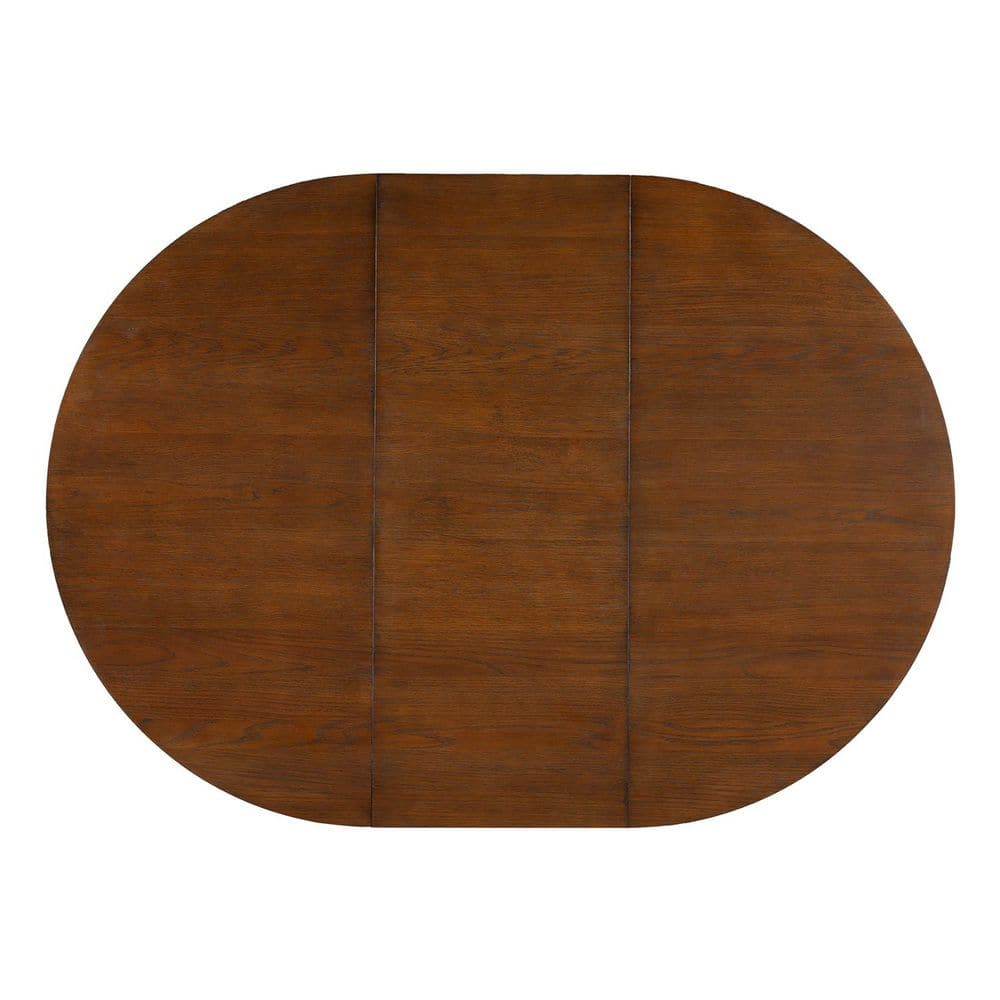 Top-down view of the round wood dining table surface.