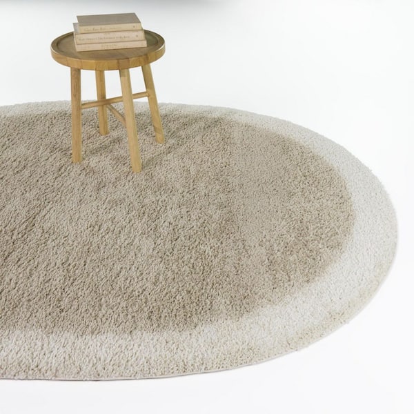 Odelle Beige 5 ft. 3 in. x 6 ft. 11 in. Oval Solid Border Area Rug