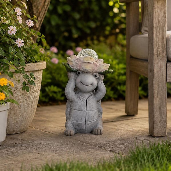 Liv & Skye Gray 15 in. Ceramic Turtle Holding Large Solar Flower