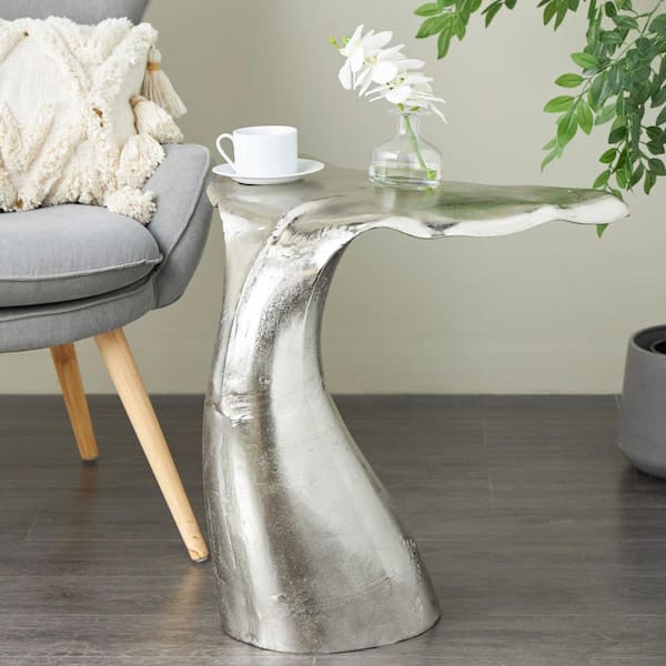 Litton Lane 23 in. Silver Whale Tail Round Metal Coffee Table