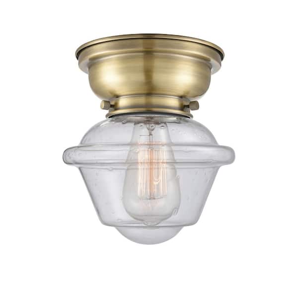 Oxford 7.5 in. 1-Light Antique Brass Traditional Flush Mount with Seeded Glass Shade