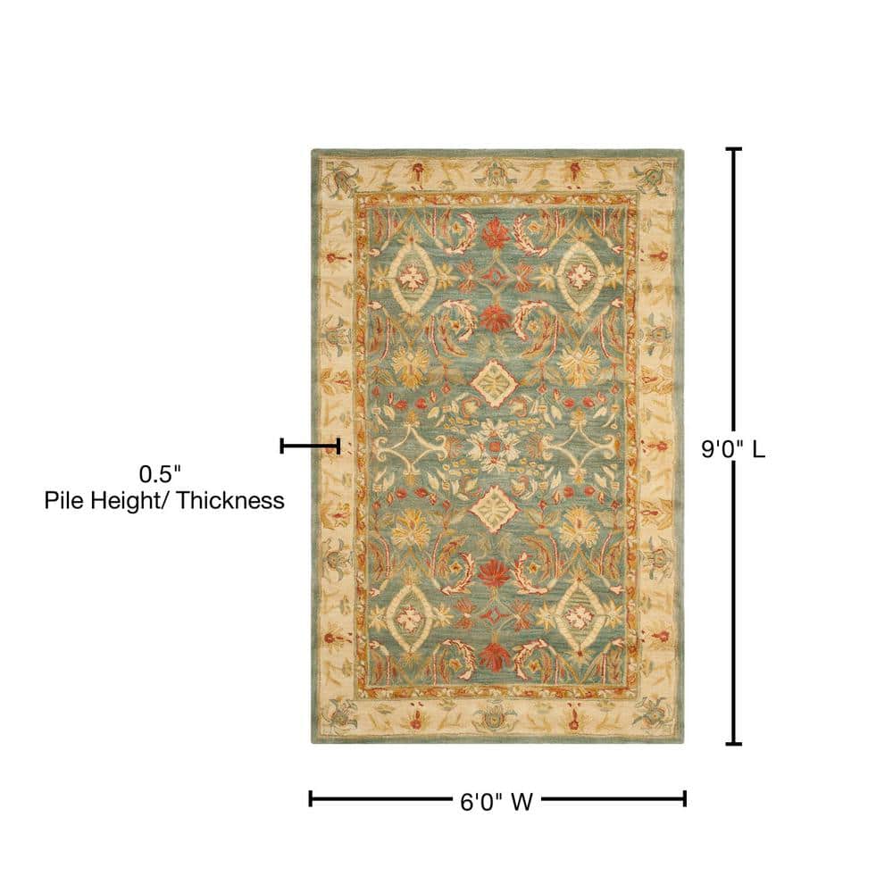Handmade Light Blue and Ivory Floral Wool 6' x 9' Area Rug