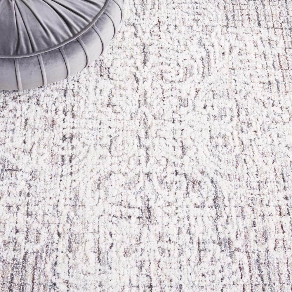 Ebony 6' x 9' Brown and Ivory Wool Tufted Area Rug