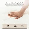 Hand touching the cooling knit cover of the Polar Hybrid mattress