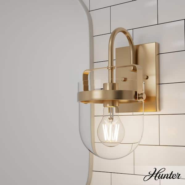 Hunter Karloff 1-Light Alturas Gold Wall Sconce with Clear Glass Shade
