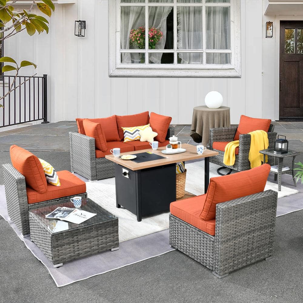 Daffodil Y Gray 8-Piece Wicker Patio Storage Fire Pit Conversation Set with Swivel Rocking Chair and Orange Red Cushions