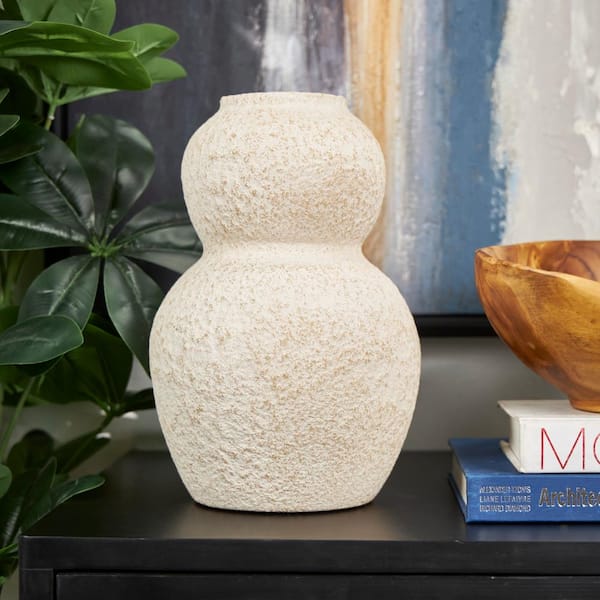 Litton Lane 12 in. Cream Hourglass Textured Ceramic Decorative Vase with Brown Distressing