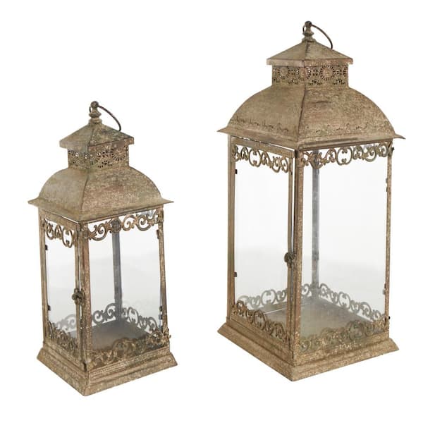 Litton Lane Brown Metal Distressed Vintage Inspired Ornate Scroll Candle Lantern Set of 2