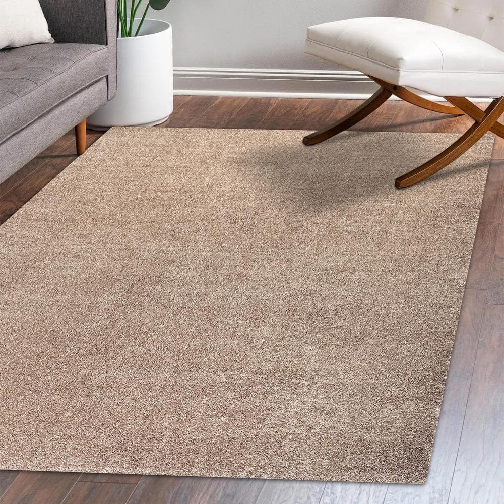 Beige 12' x 15' Solid Synthetic Low-Pile Area Rug