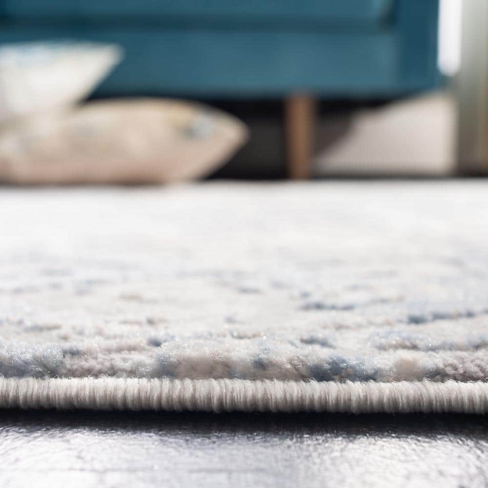 Light Grey and Blue Synthetic 10' x 14' Area Rug