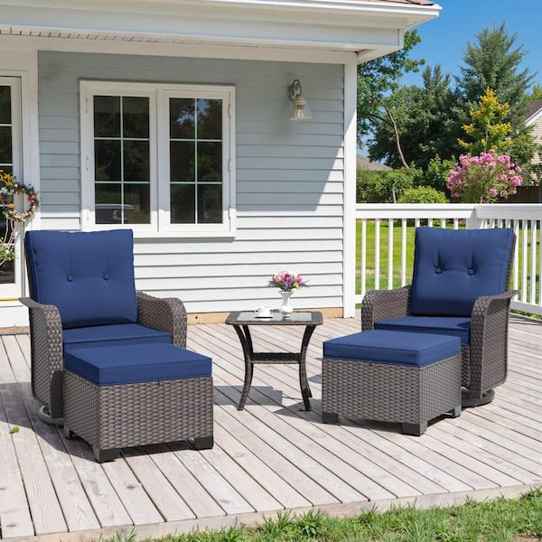 5-Piece Brown Wicker Swivel Rocker Patio Conversation Set with Navy Blue Cushions and Ottomans