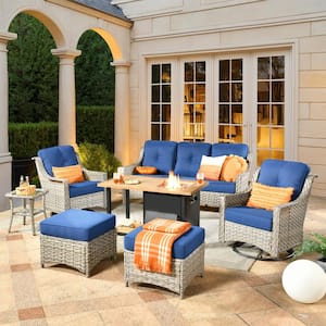 Denver 7-Piece Wicker Outdoor Patio Conversation Sofa Set with Swivel Chairs, a Storage Fire Pit and Navy Blue Cushions