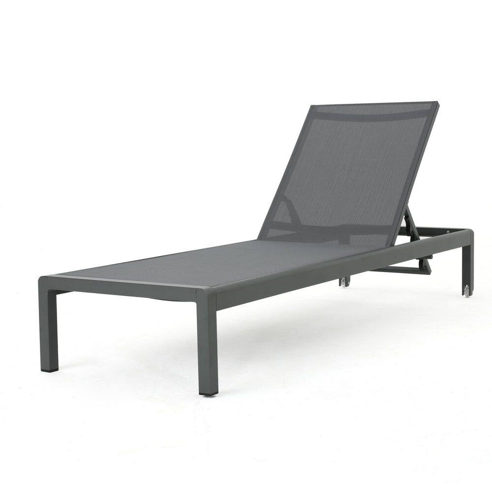 Gray metal outdoor chaise lounge viewed from the side.