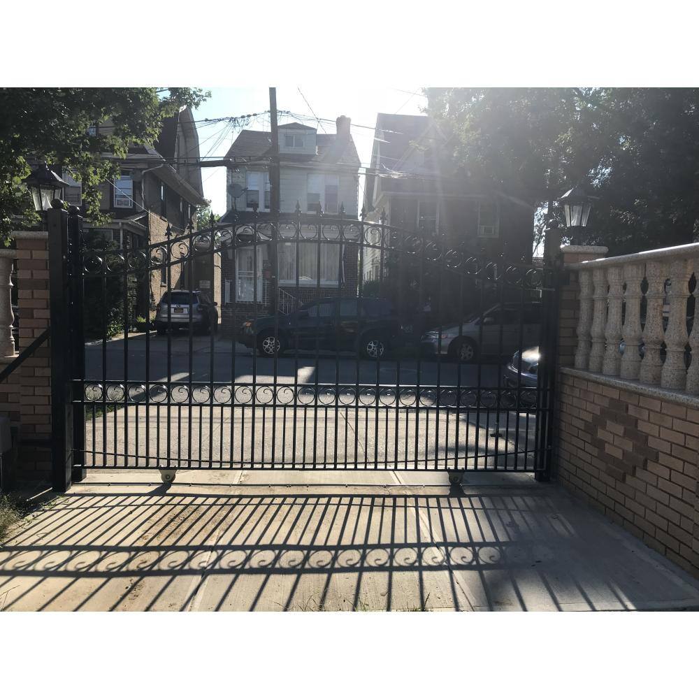 Black Steel Arched Sliding Driveway Gate with Pointed Pickets
